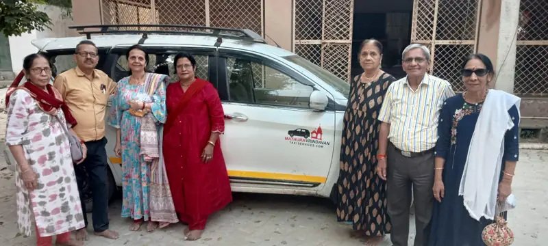 Family group with Braj Bhoomi cab after Braj darshan